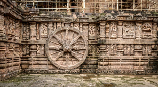 Sun Temple Intricate carvings on a stone wheel in the ancient  Hindu Sun Temple at Konark, Orissa, India. 13th Century AD chariot wheel at konark sun temple india stock pictures, royalty-free photos & images