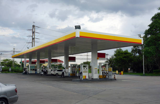 Image of a gas station with cars being refulled Image of a gas station with cars being refulled military tanker airplane photos stock pictures, royalty-free photos & images