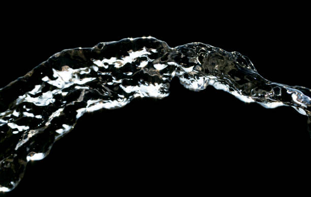 istock stream of water on a black background 865464300