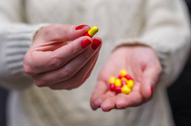 istock Woman dressed in winter clothes with medicines 865467862