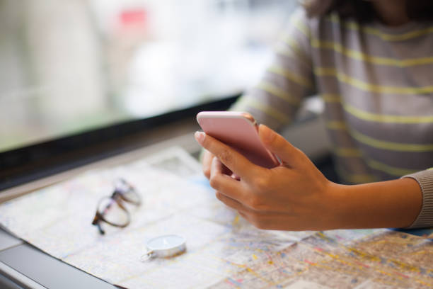 istock Woman in train with smartphone 865470728