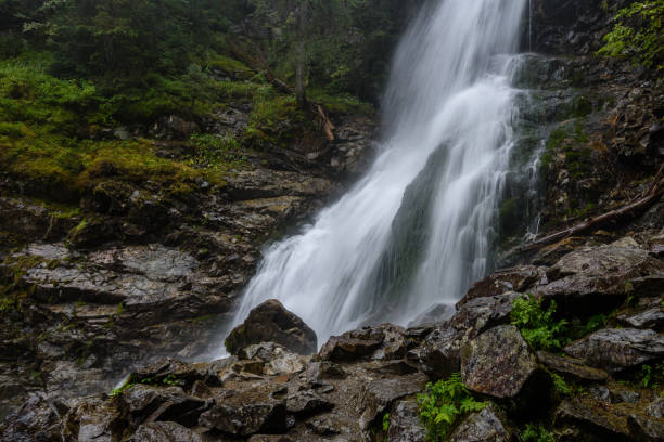 istock large Waterfall from ravine in autumn, long exposure 865471222