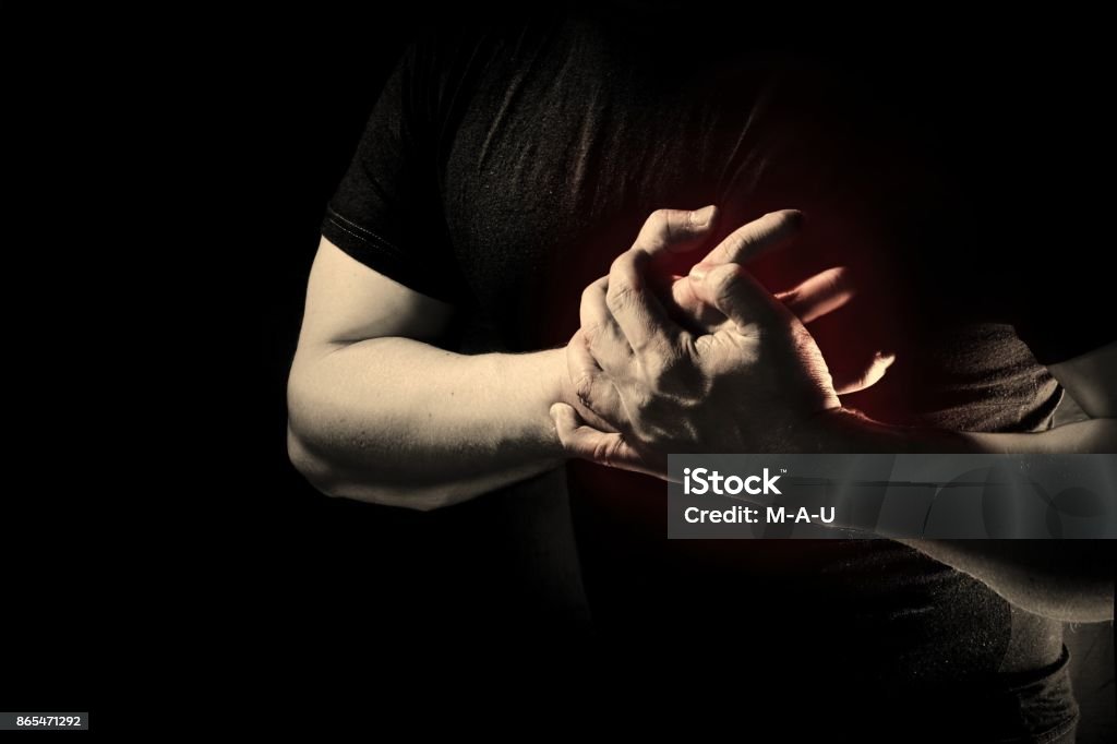 Man suffering from chest pain, having heart attack Adult Stock Photo
