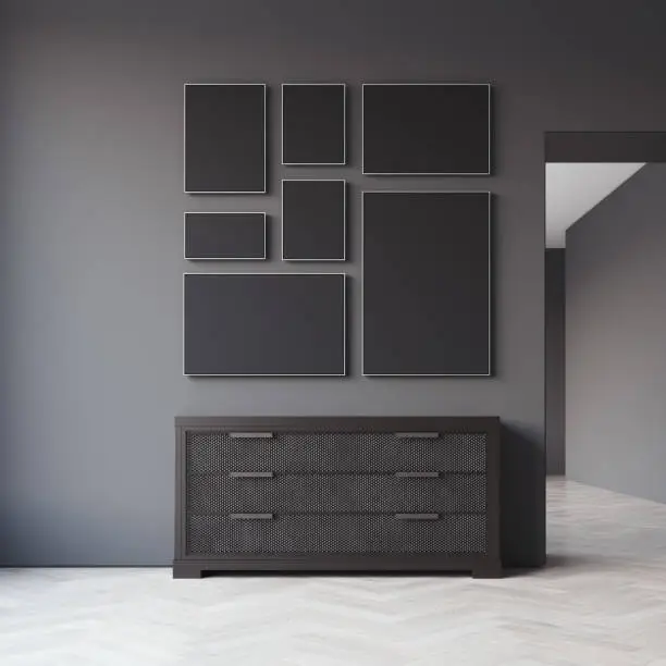 Dark guestroom with seven blank picture frames. 3d rendering