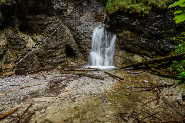 istock large Waterfall from ravine in autumn, long exposure 865475232