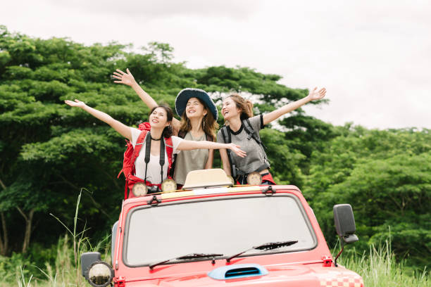Enjoy nature during vacation travel trip in forest Happy Asian women friends backpacker enjoy nature during vacation travel trip in forest. happy car asian stock pictures, royalty-free photos & images