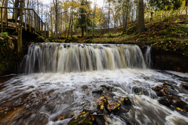 istock Waterfall from ravine in autumn, long exposure 865477814