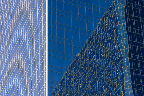 istock Reflection of light and surroundings on a glass-fronted office building 865478290