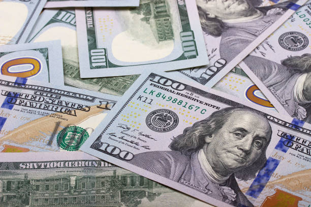 istock 100 US dollar abstract money cash background. 865480792