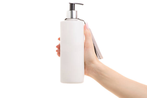 istock Cream with a dispenser in a female hand 865482110