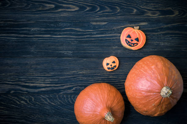 istock Halloween background with pumpkins and cookies 865482968