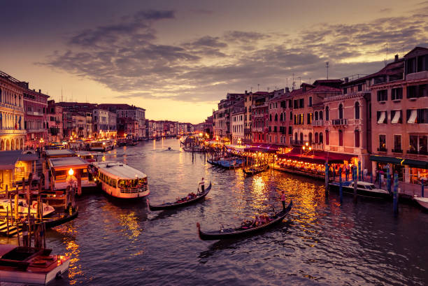 istock Grand Canal with gondolas at night in Venice 865487508