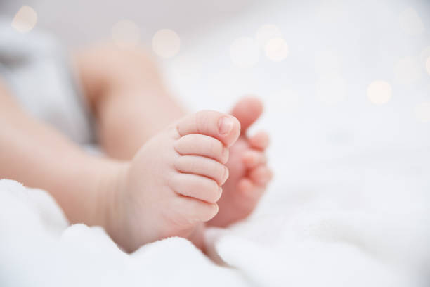 Baby feet closeup stock photo