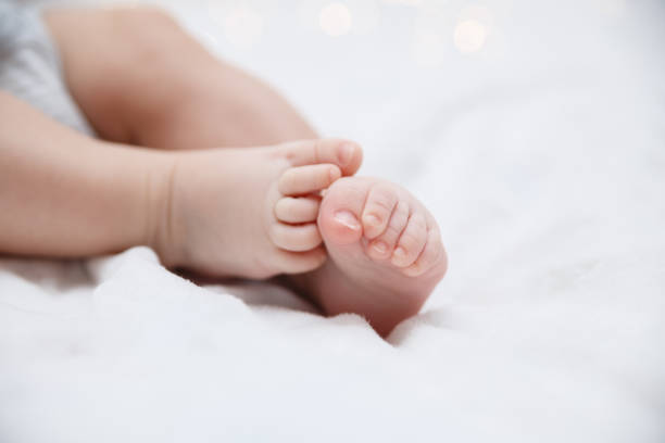 istock Baby feet closeup 865488580