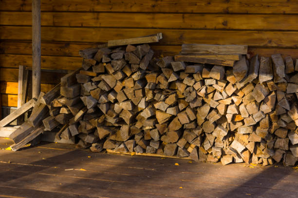 istock Chopped wood under a canopy in a village house 865489126