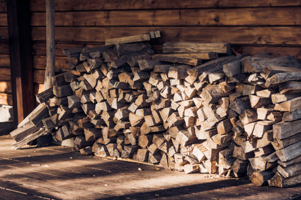 istock Chopped wood under a canopy in a village house 865489152