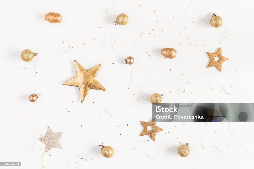 Christmas golden decorations on white background. Flat lay, top view Christmas composition. Christmas golden decorations on white background. Flat lay, top view Christmas Stock Photo