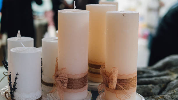 istock beautiful wax candles in Boho style close-up. Colored wax candles for spa 865497026