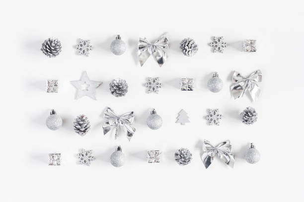 istock Christmas silver decorations on white background. Flat lay, top view 865499498