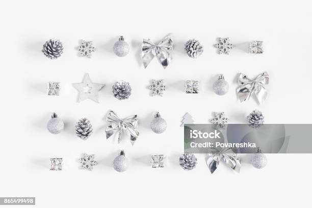 Christmas Silver Decorations On White Background Flat Lay Top View Stock Photo - Download Image Now