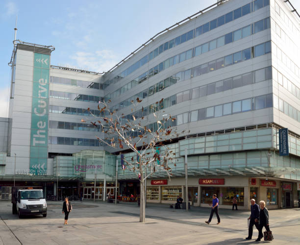 Exterior view of shopping mall building on High Street in Slough Slough, United Kingdom - September 7, 2017. Exterior view of shopping mall building on High Street in Slough, with sculptures and buildings thames valley stock pictures, royalty-free photos & images
