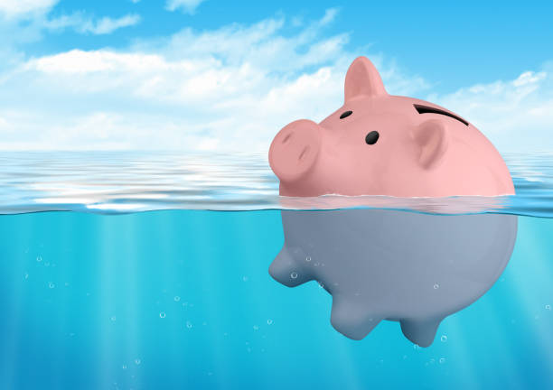 istock Piggy bank sinking, savings loss concept 865506398