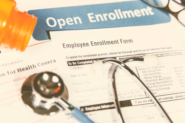 istock Open enrollment healthcare benefit forms. 865512626