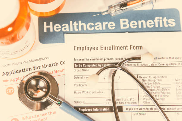 istock Open enrollment healthcare benefit forms. 865512678
