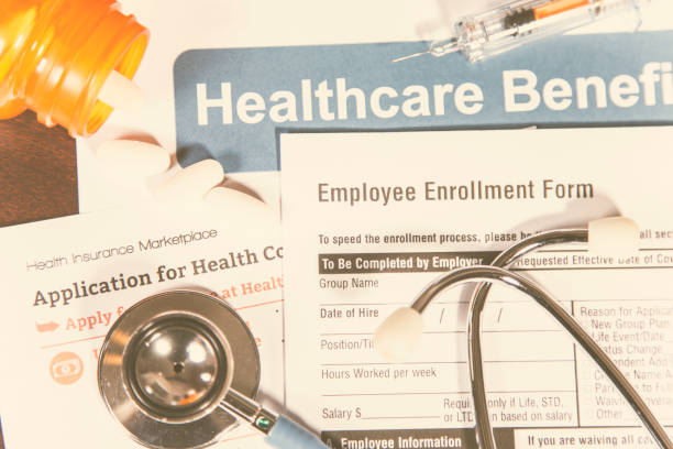 istock Open enrollment healthcare benefit forms. 865512696