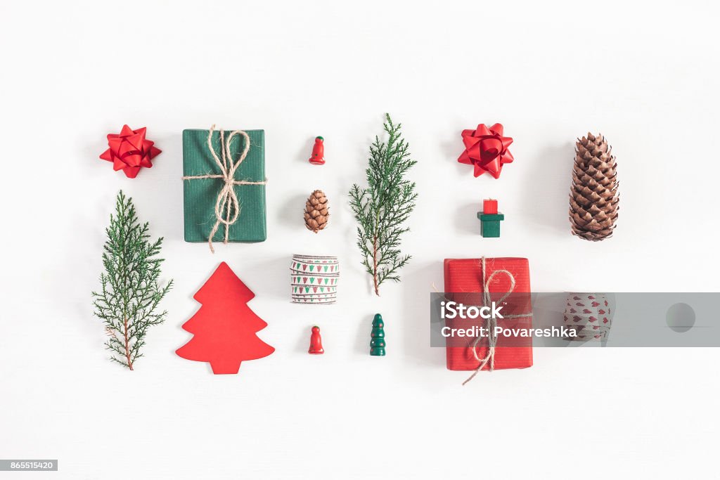 Christmas gifts, pine branches, toys. Flat lay, top view Christmas composition. Christmas gifts, pine branches, toys on white background. Flat lay, top view Christmas Stock Photo