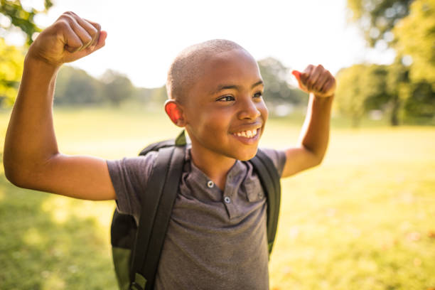 istock little kid showing the muscle 865515450