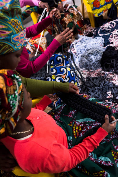 istock Women weaving in african business 865520270