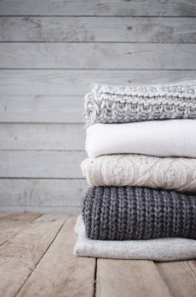 istock Knitted sweaters and fallen yellow leaves 865524498