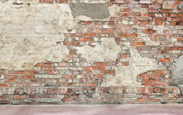 grunge wall background grunge wall background, bricks and pieces of plaster plaster photos stock pictures, royalty-free photos & images