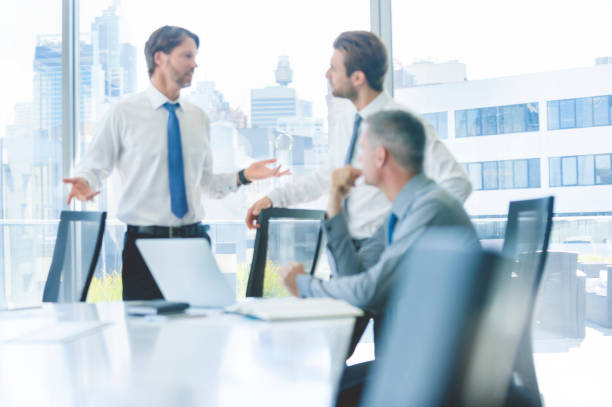 istock Three businessmen meeting in a boardroom. 865530444