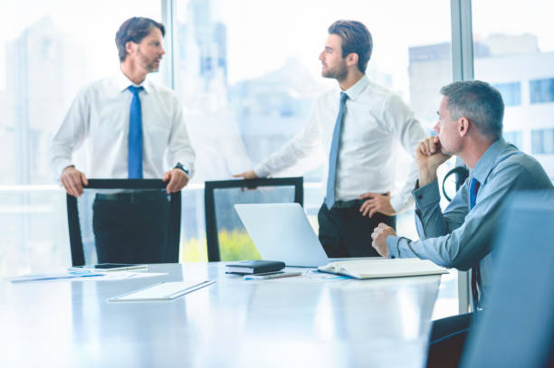 istock Three businessmen meeting in a boardroom. 865530506