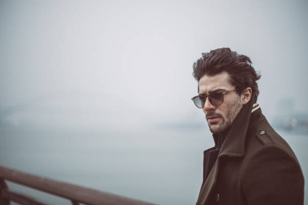 istock Gentleman by the lake alone 865534038