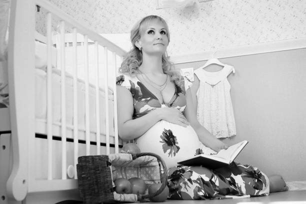 Beautiful girl pregnant blonde prepares to become a mom
