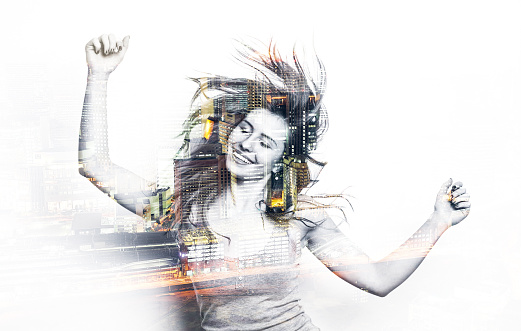 Double exposure of a dancing woman