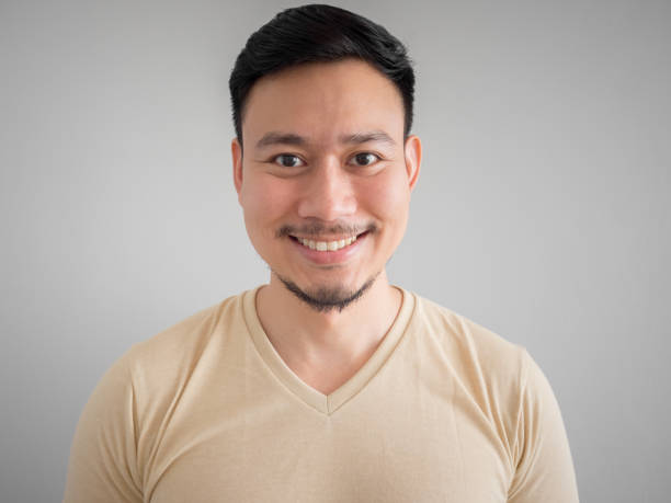 istock Headshot of happy Asian man. 865541402