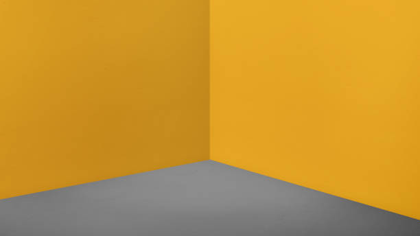 istock Empty corner yellow wall and dark grey floor perspective room,Modern style room,Mock up for display of product,business presentation 865543840