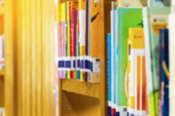 istock Books on bookshelf in library room, abstract blur de focused background 865545252