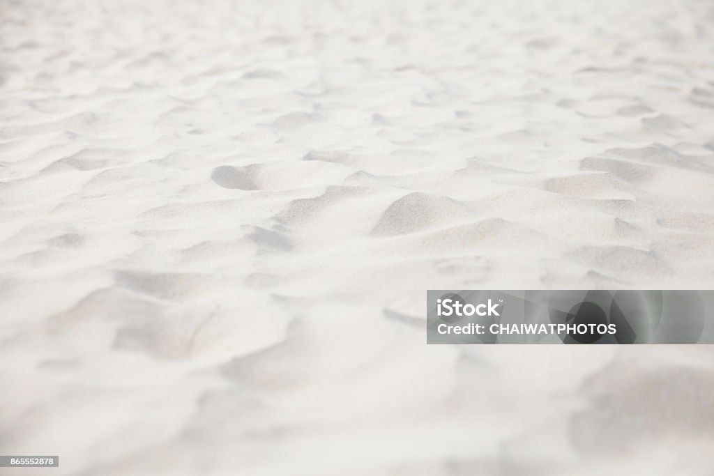 Sandy beach with sea on background. White Color Stock Photo