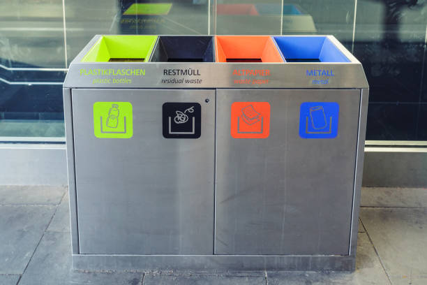 istock Rubbish bins for collection of recycled materials with different sticker 865555836