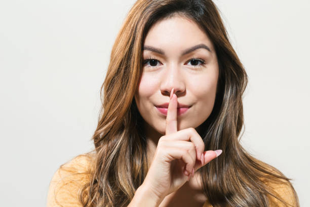 istock Young woman a quiet gesture 865563010