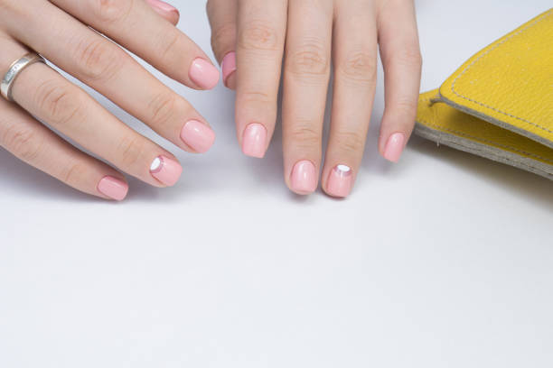 istock Natural nails with gel polish applied. Ideal manicure and women's hands. 865566236