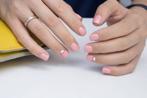 istock Natural nails with gel polish applied. Ideal manicure and women's hands. 865566260