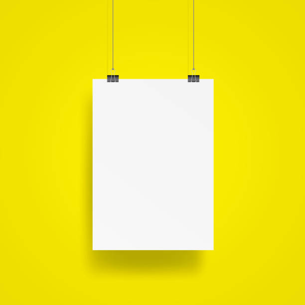 istock Blank Hanging poster with clip and wire mockup vector on yellow background. Mockup concept 865570532