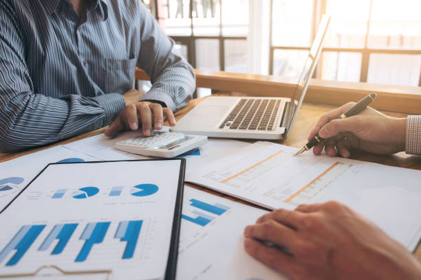 istock Business team meeting working with new startup project, discussion and analysis data the charts and graphs. Digital tablet calculator, laptop computer using, Business finances and accounting concept 865578560