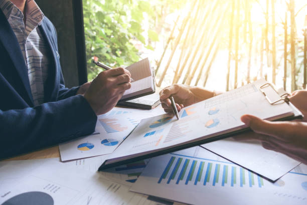 istock Business team meeting working with new startup project, discussion and analysis data the charts and graphs. Digital tablet calculator, laptop computer using, Business finances and accounting concept 865578594